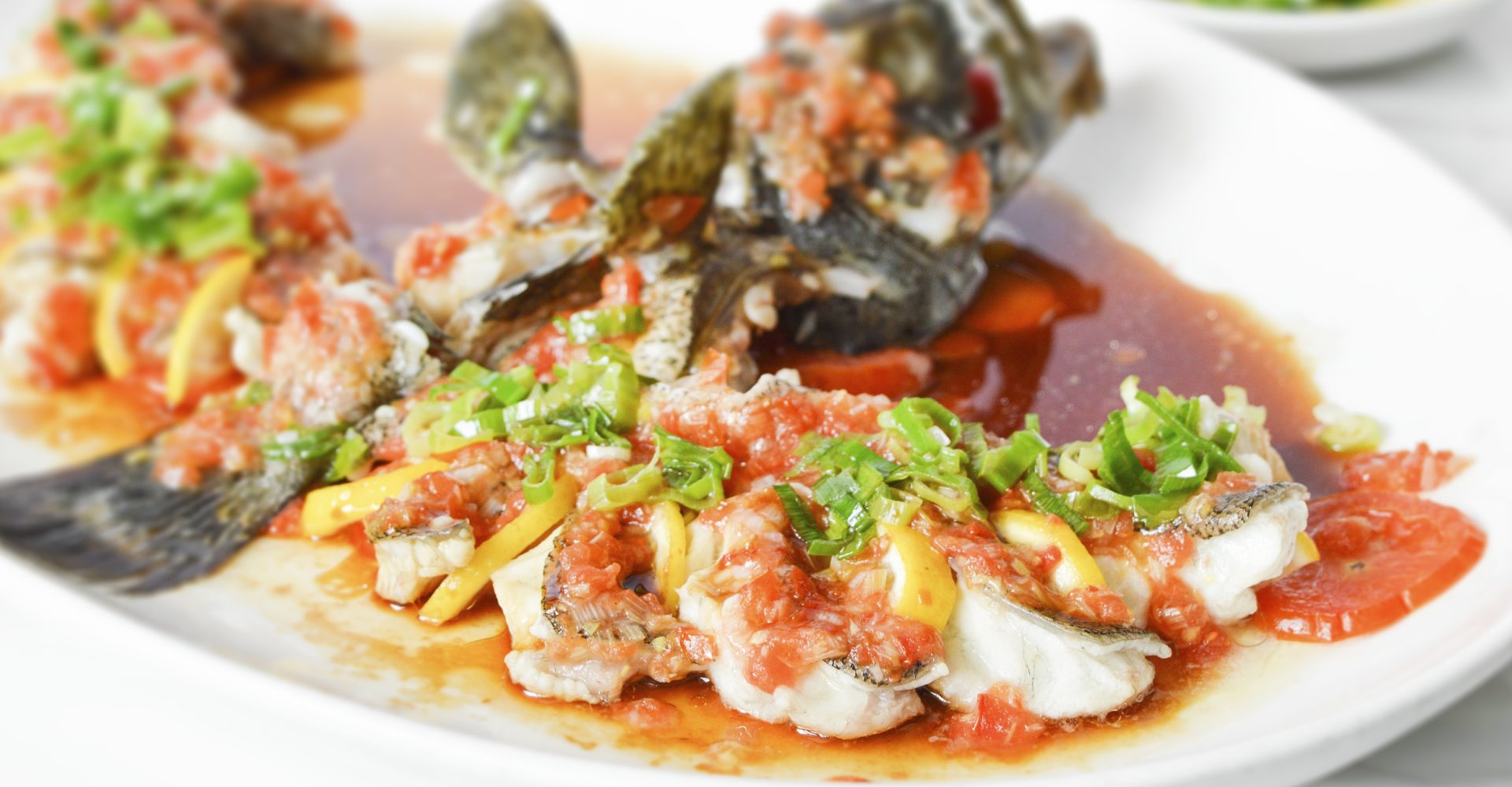 Steamed lapu-lapu with lemon in light soy sauce